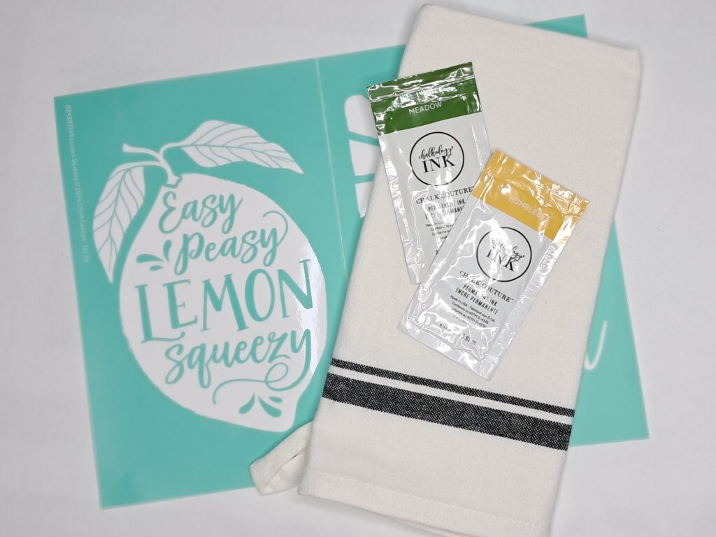Supplies shown are a silk screen mesh stencil, a tea towel, and two packets of permanent ink.
